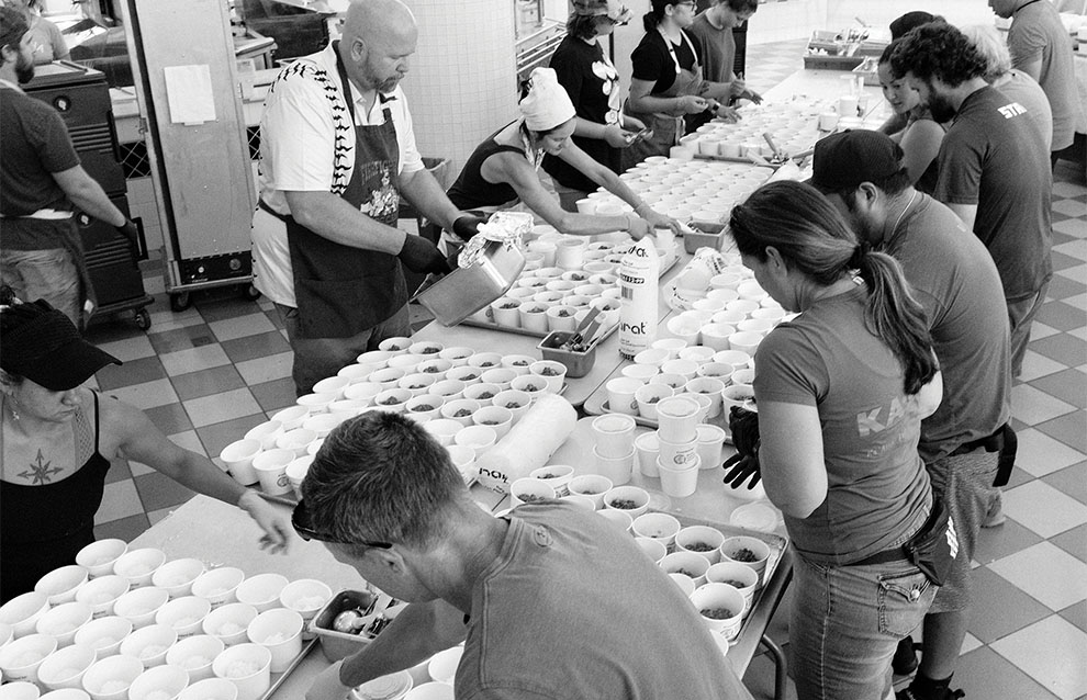 a group of people preparing food