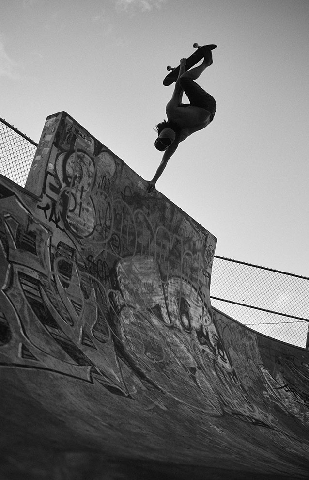 a person on a skateboard performing a trick in the air