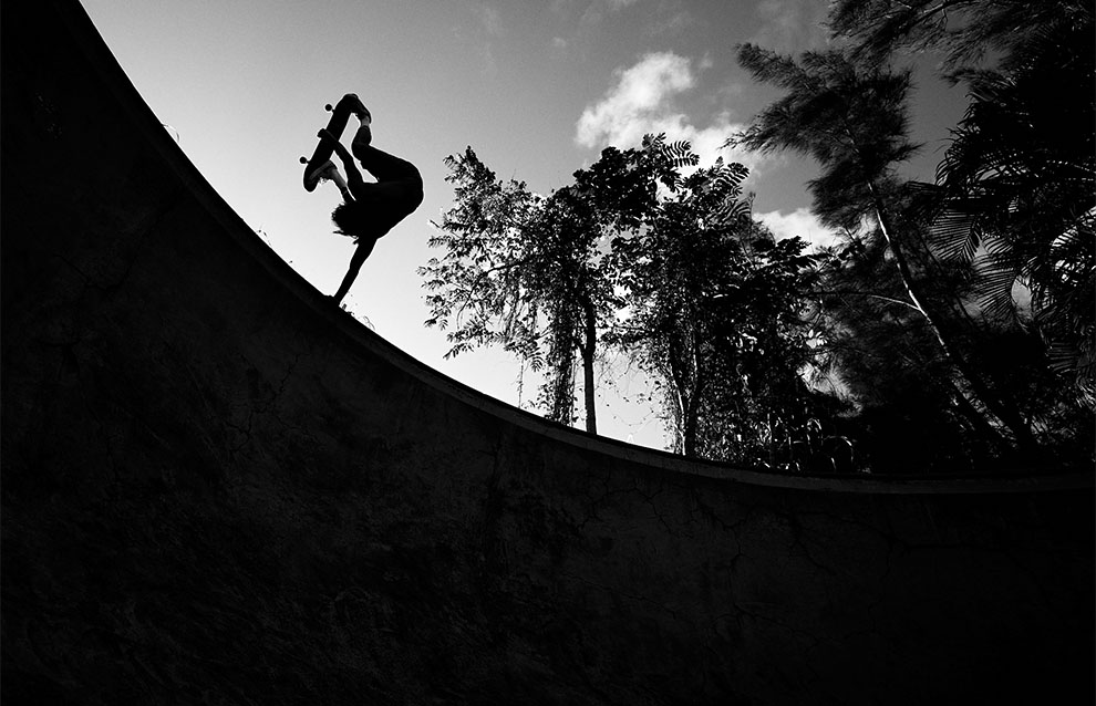 a person on a skateboard performing a trick in the air