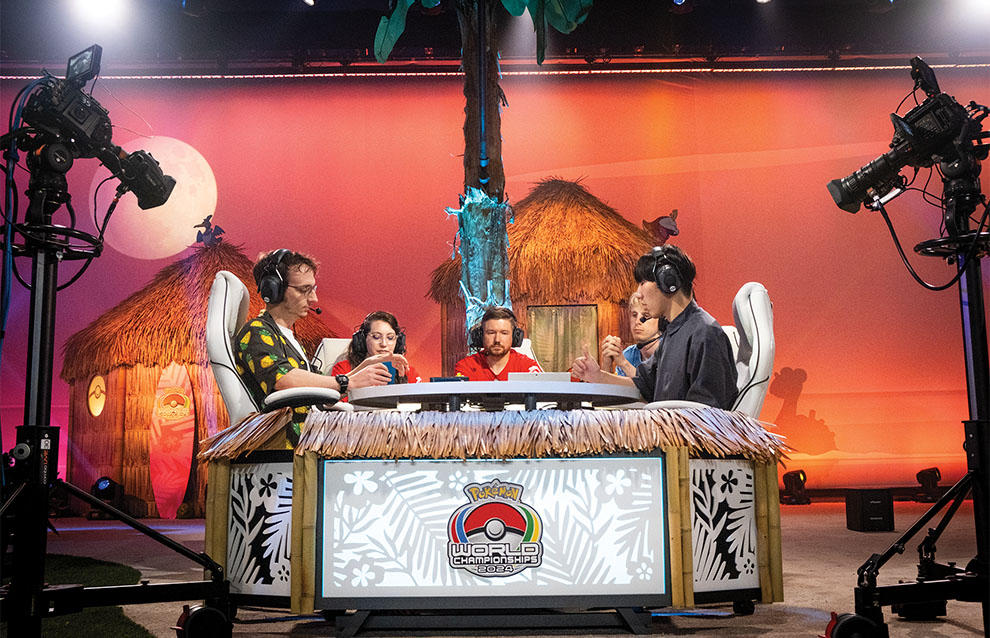 a group of people sitting on a decorated table