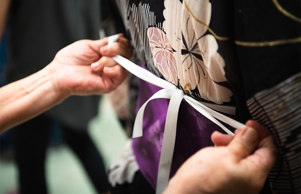 closeup of a person tying up ribbons