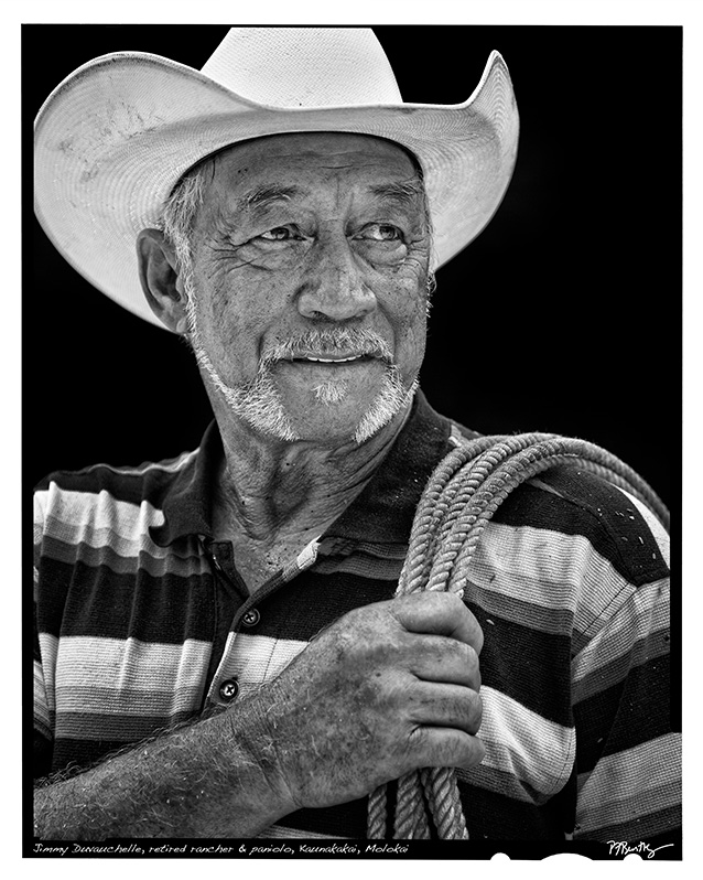 a person in a cowchild hat holding a rope
