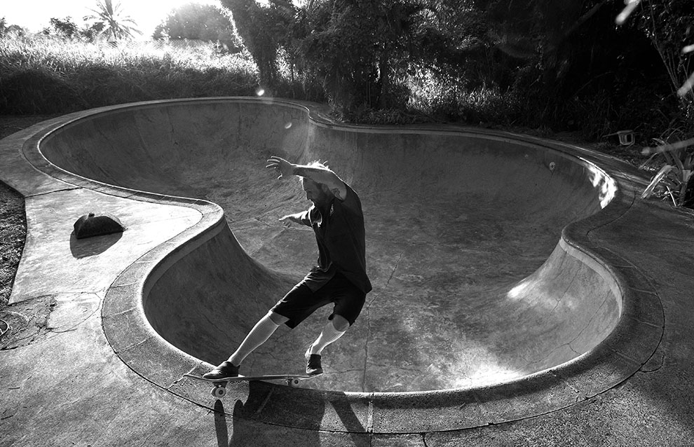 a person riding a skateboard in a skate park