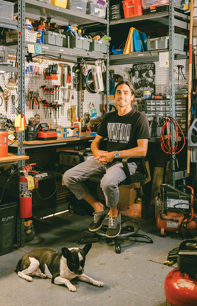 a person sitting in a chair in a workshop