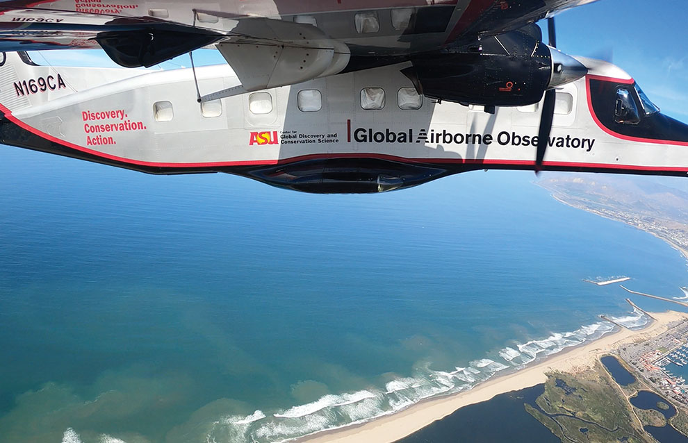 a plane flying over the ocean