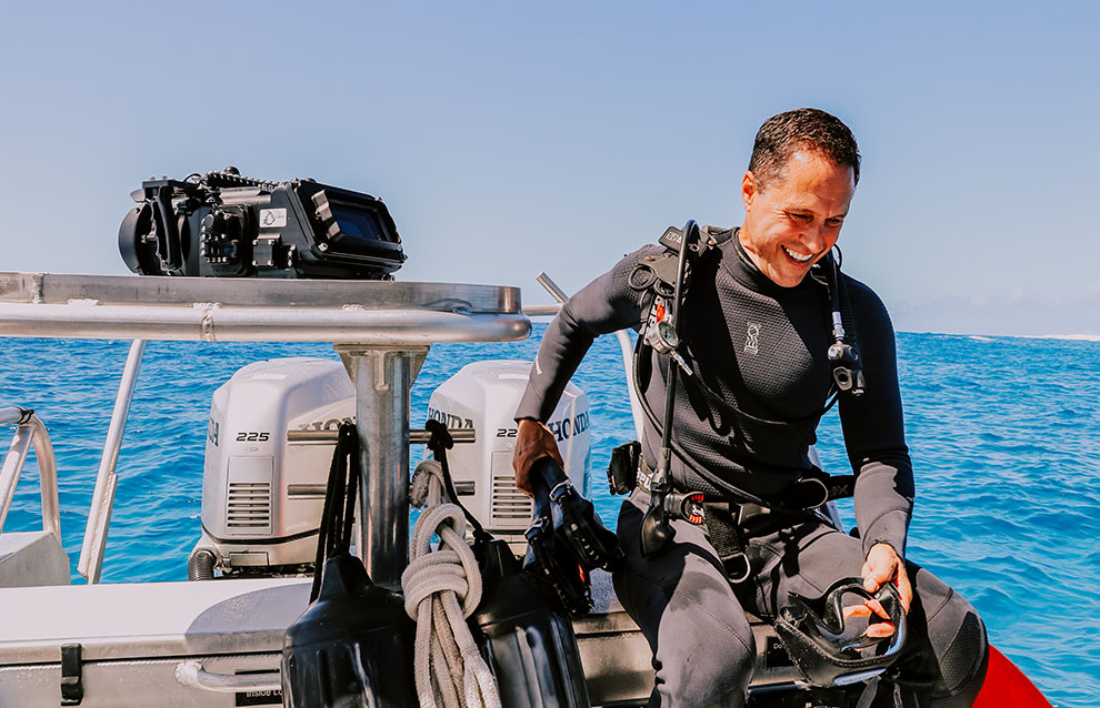 a person in a scuba gear smiling