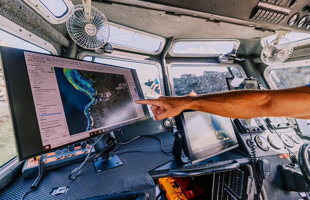 a person pointing at a computer screen