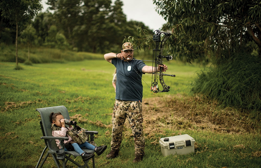 a person holding a bow and arrow