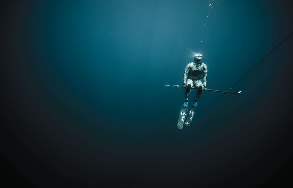 a person in water with a stick