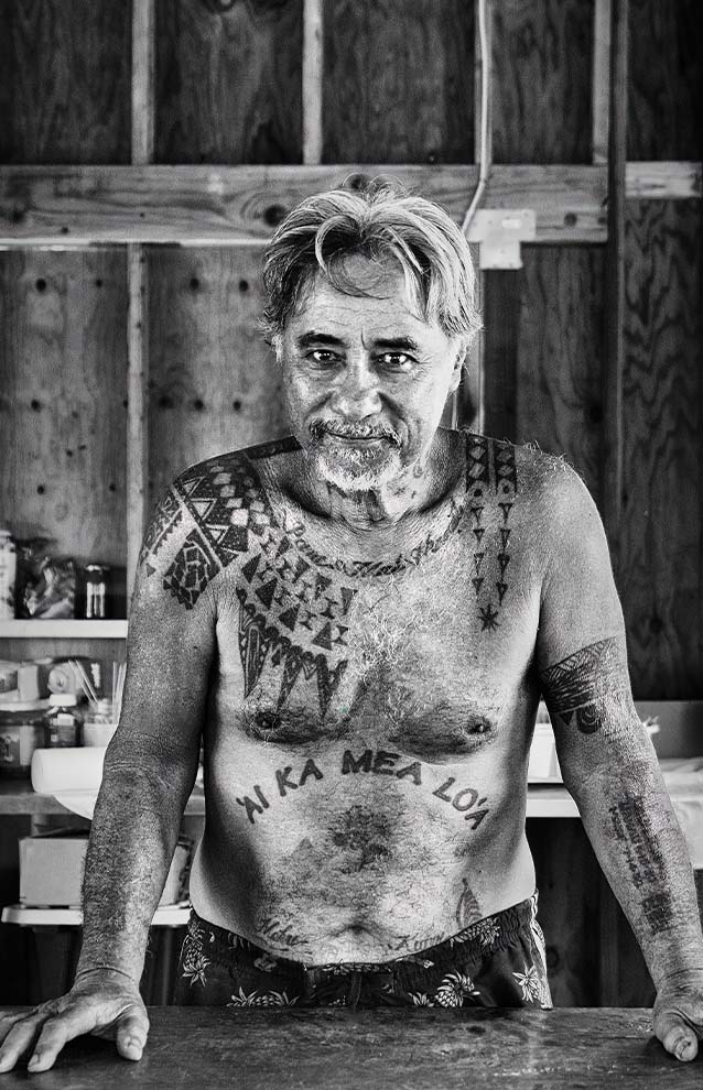 a person with tattoos on his chest