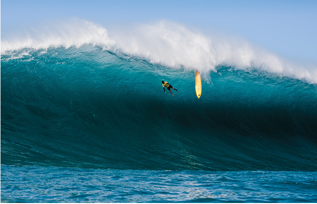 a person surfing on a wave