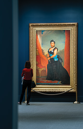 a person looking at a painting