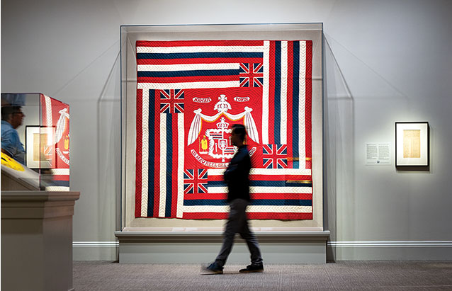 a person walking past a flag