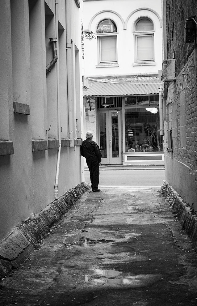 a person standing on a sidewalk