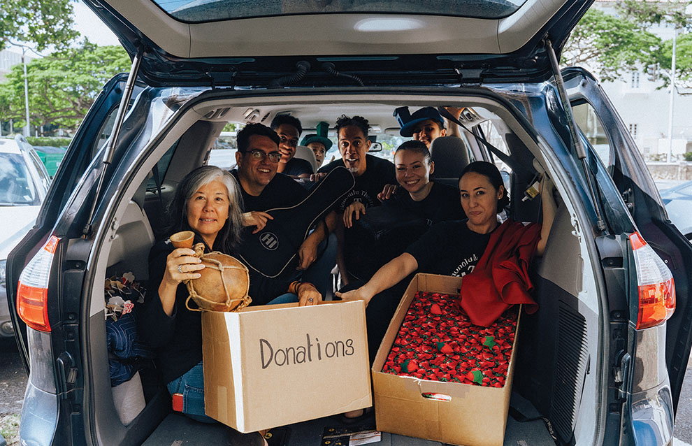 a group of people in the back of a car