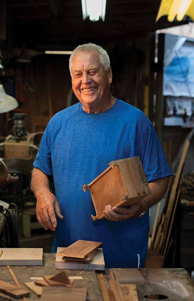 a person holding a wooden box