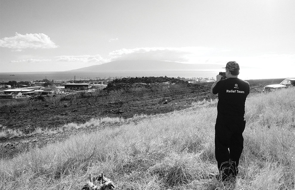 a person taking a picture of a landscape