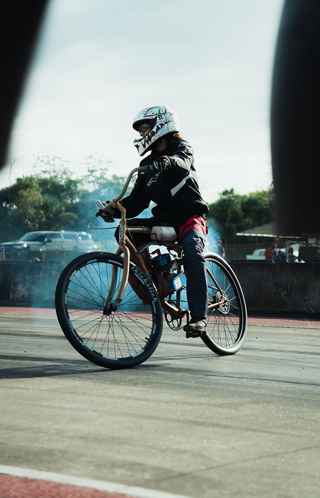 a person wearing full protective gear riding a motorcycle