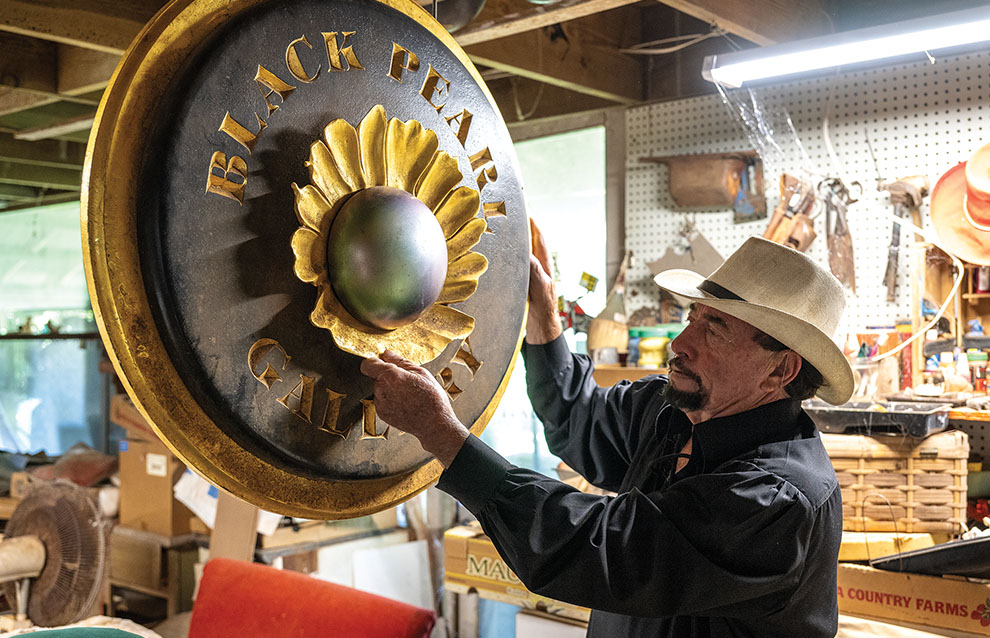 a person fixes a sculpture