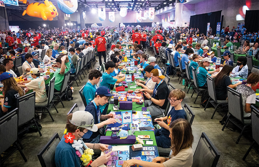 a room full of people sitting on tables