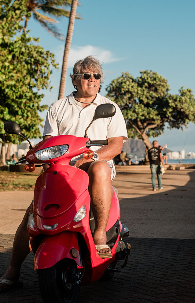 a person on a vespa