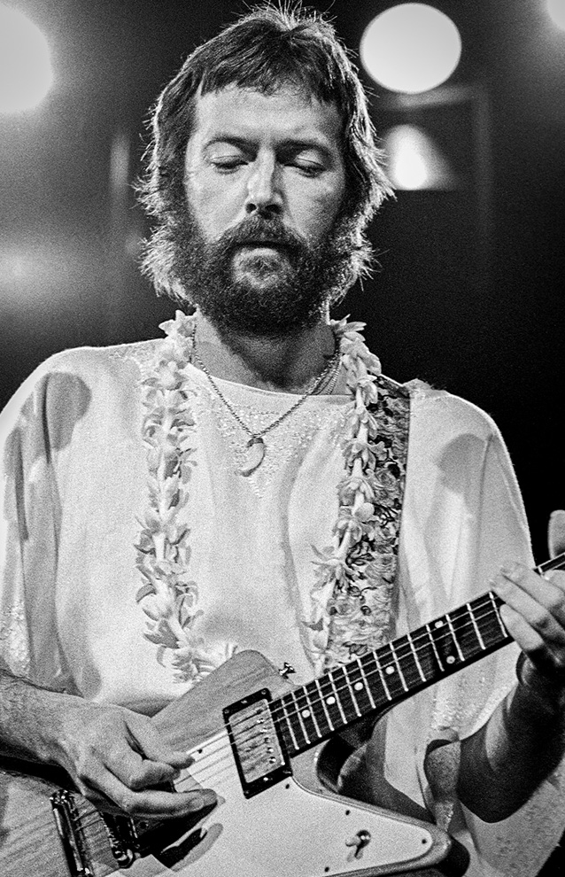 a person playing an electric guitar