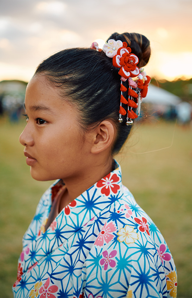 a child wearing flower patterned Japanese garb with style air
