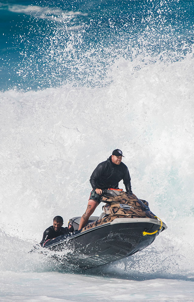 a person riding a jetski thru wakes